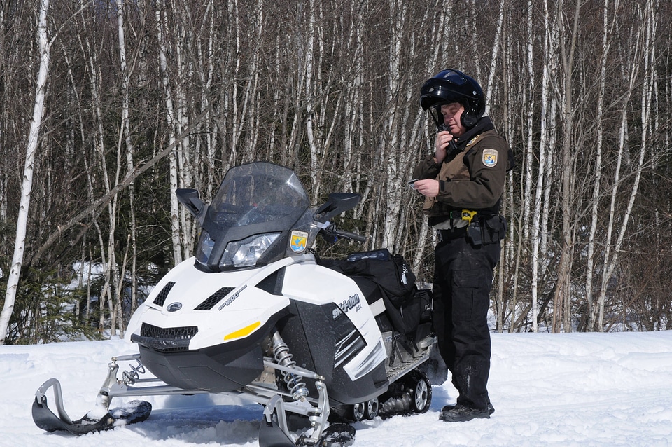 Service Law Enforcement Officer and snowmobile