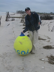 Forsythe intern with beach pollution