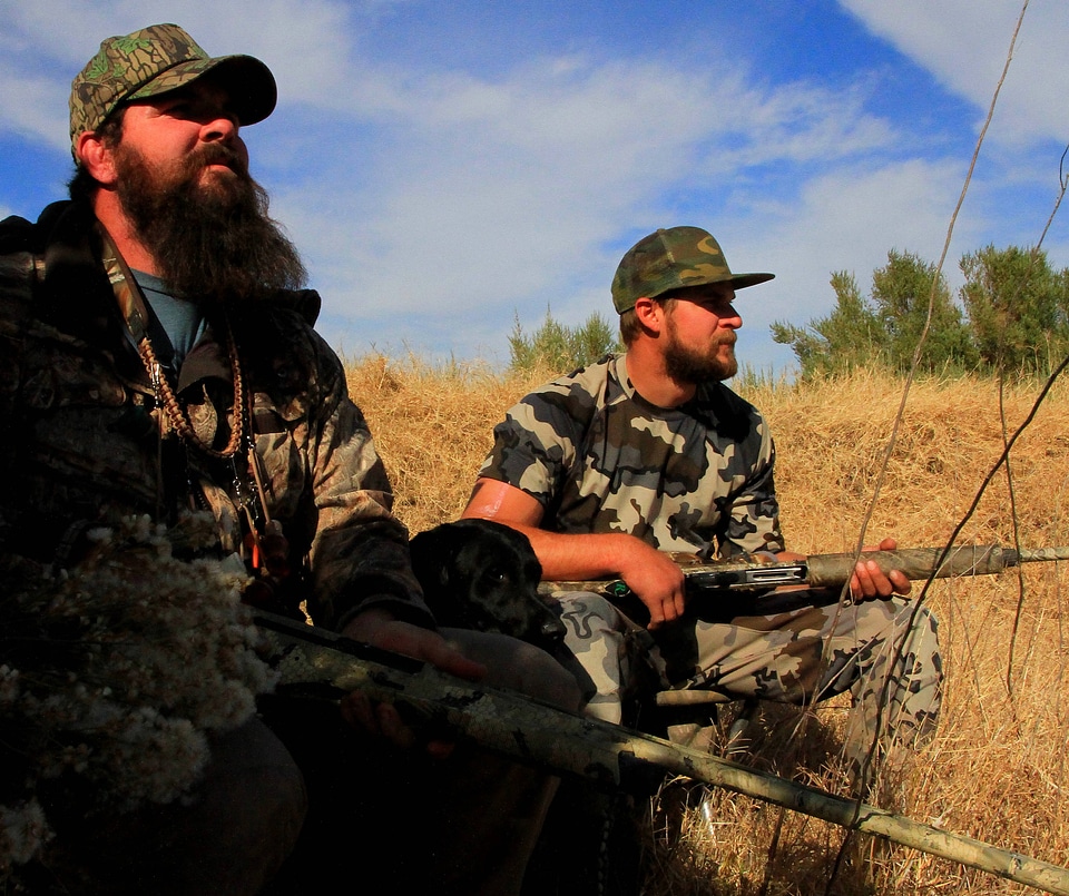 Duck hunters with dog