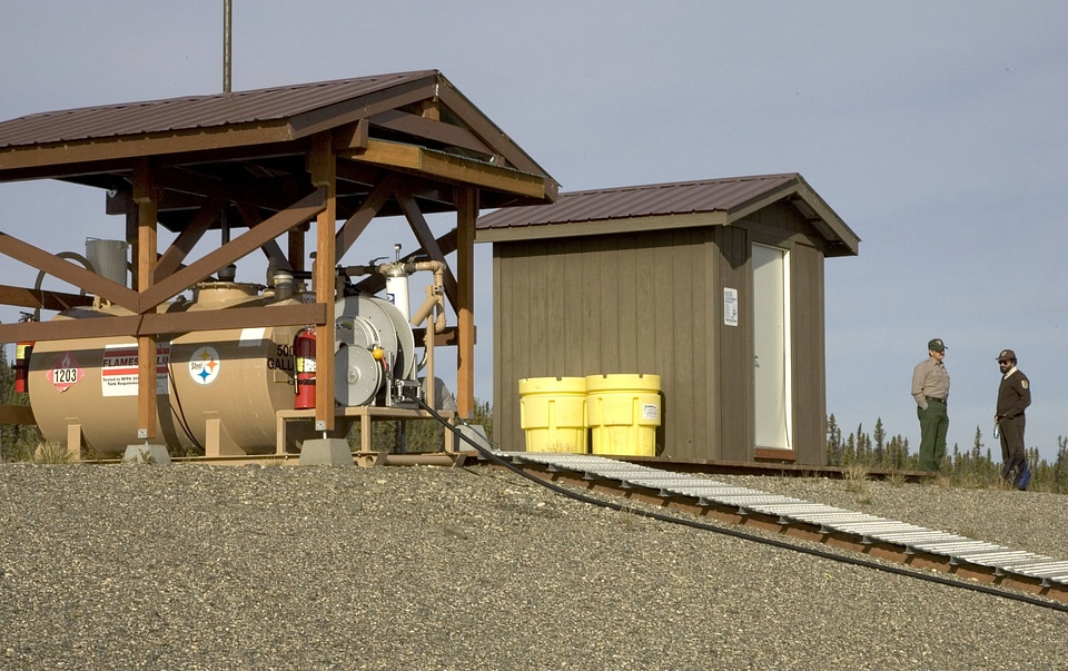Service employees by a propane fueling station
