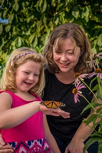 Mother and daughter with monarch
