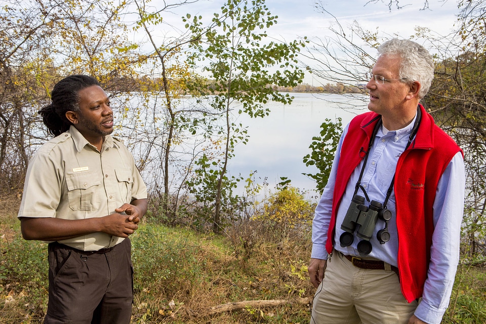 Employee communicates with a refuge visitor at John Heinz National Wildlife Refuge