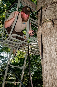 NCTC land management specialist inspecting deer stand for safety-2