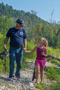 Older man with young girl fishing-3