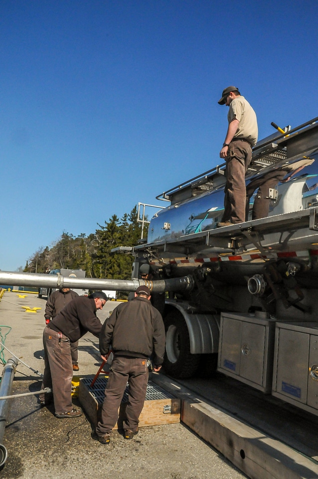 FWS staff loading juvenile lake trout onto MV Spencer Baird-1