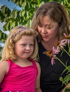 Mother and daughter looking at monarch-2