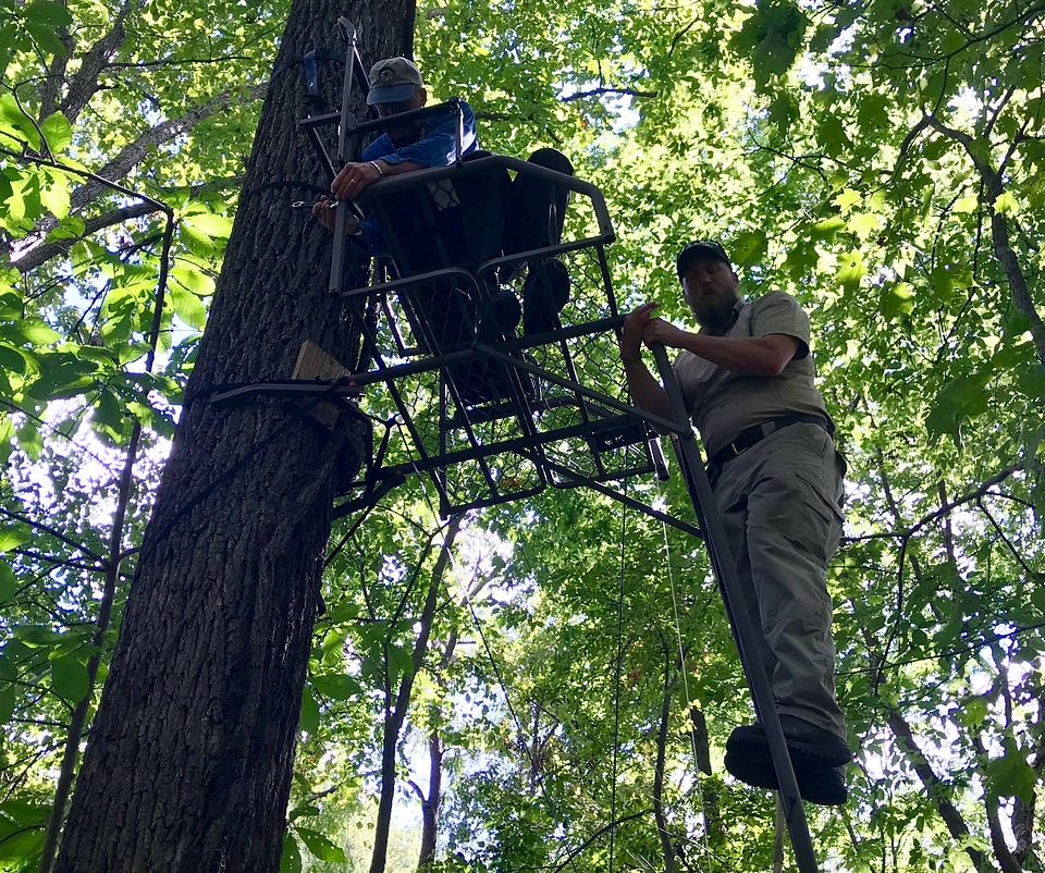FWS employees repairing deer stand