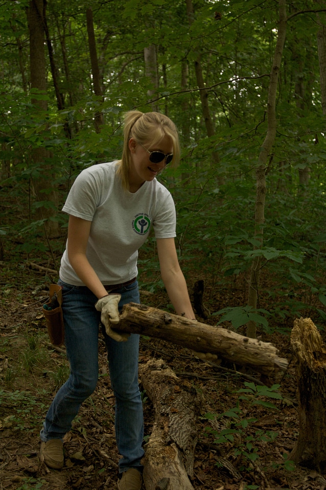 Youth Conservation Corps student clearing a trail