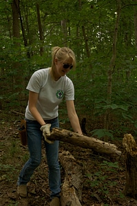 Youth Conservation Corps student clearing a trail