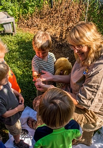 FWS employee showing children a monarch