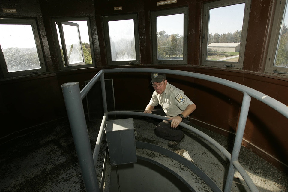 FWS employee at top of observation tower