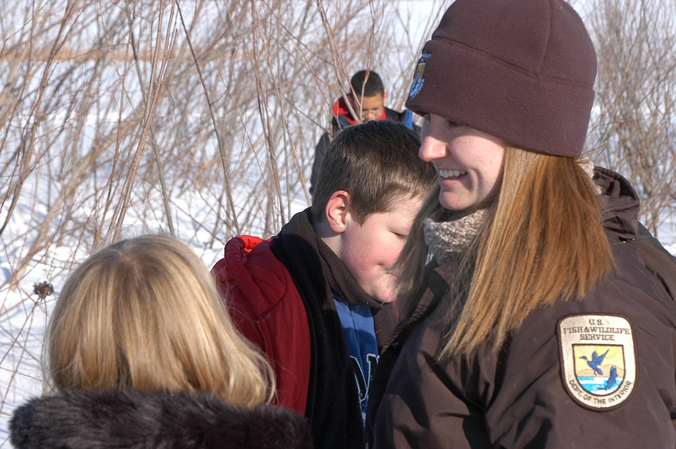 Visitor Services Specialist teaching youth in the field