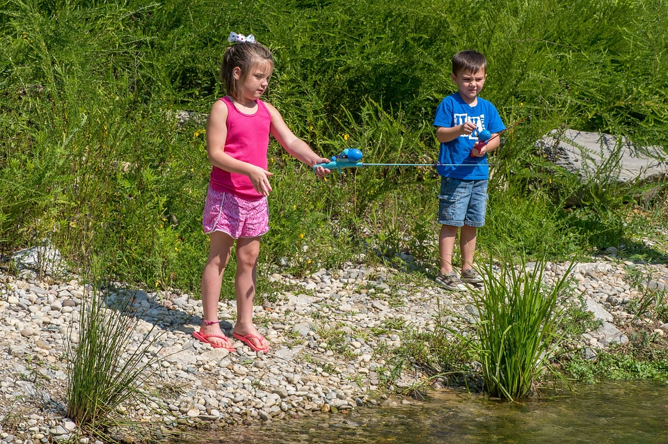 Little girl and boy fishing