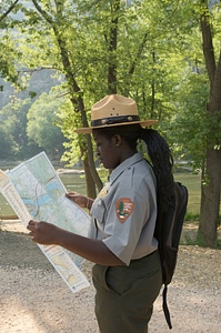 Youth park ranger studies a map