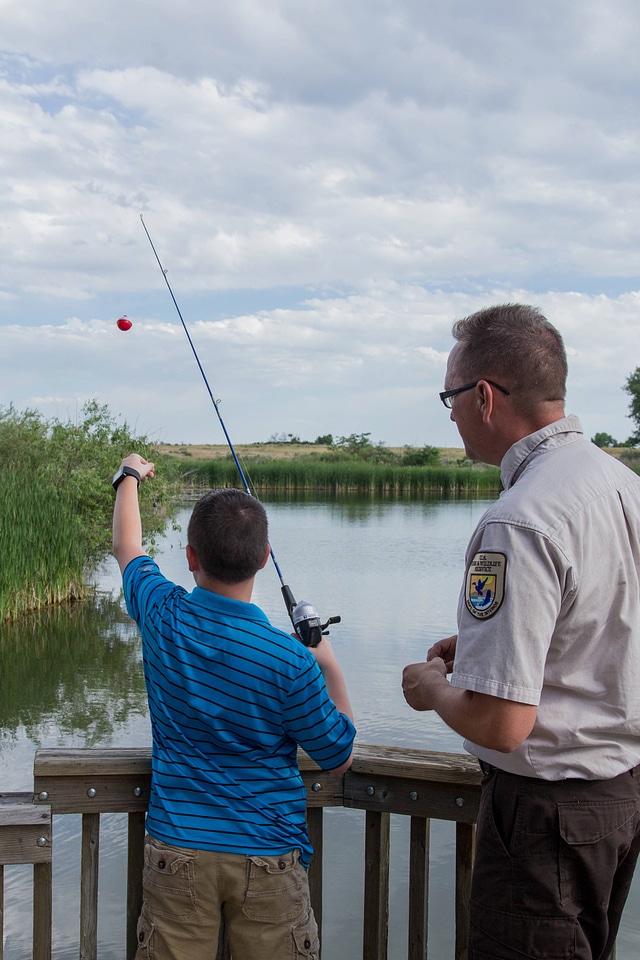 Ranger and young boy fishing-1