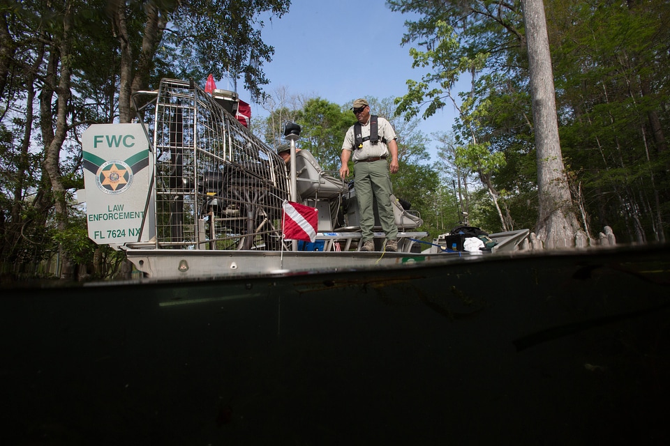 Biologist monitors aquatic plants-1