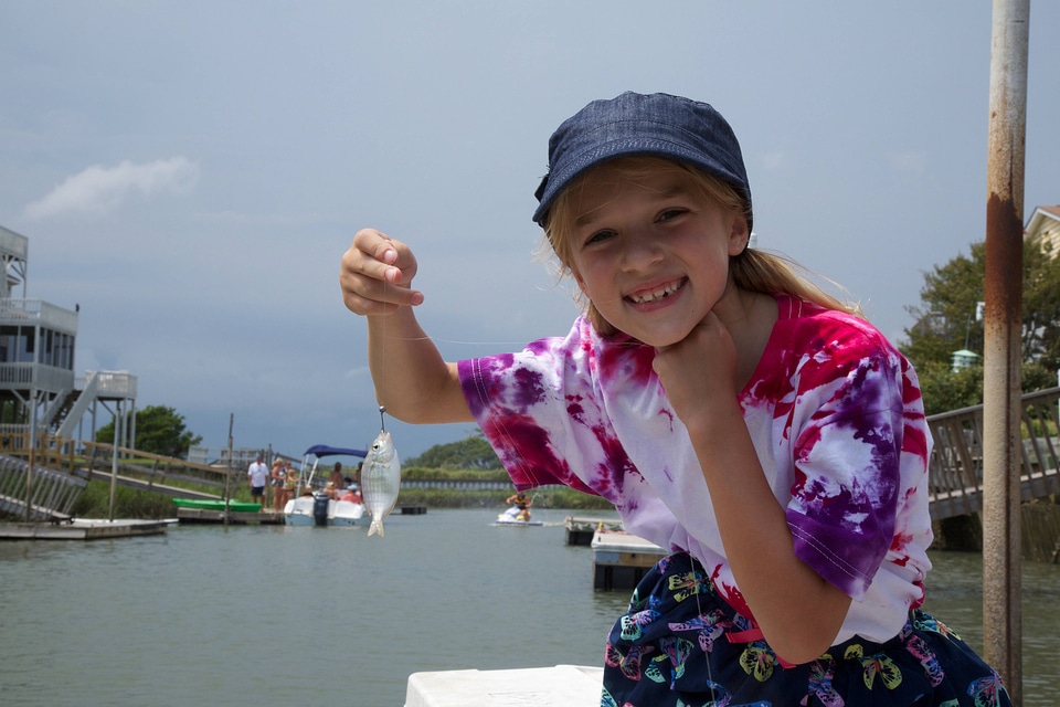 Girl holding little fish