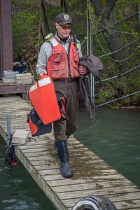 USFWS Fisheries worker carries life jackets