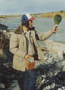 Biologist with salmon tracking device