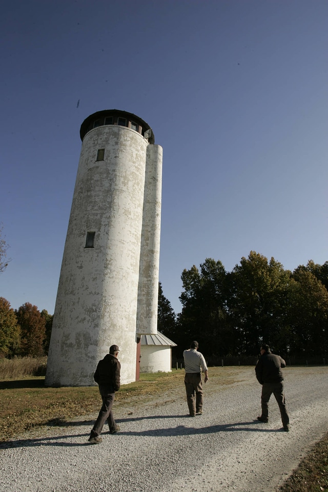 Employees approaching observation tower at Swan Lake National Wildlife Refuge