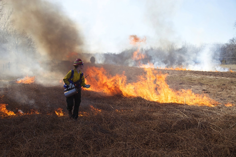 Firefighter walking from fire