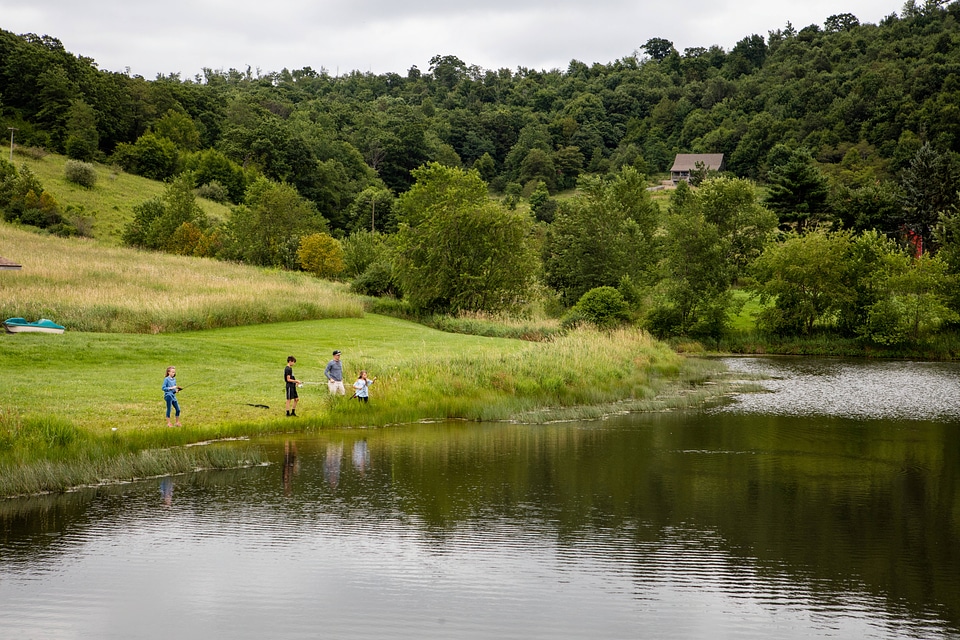 Adult with kids fishing