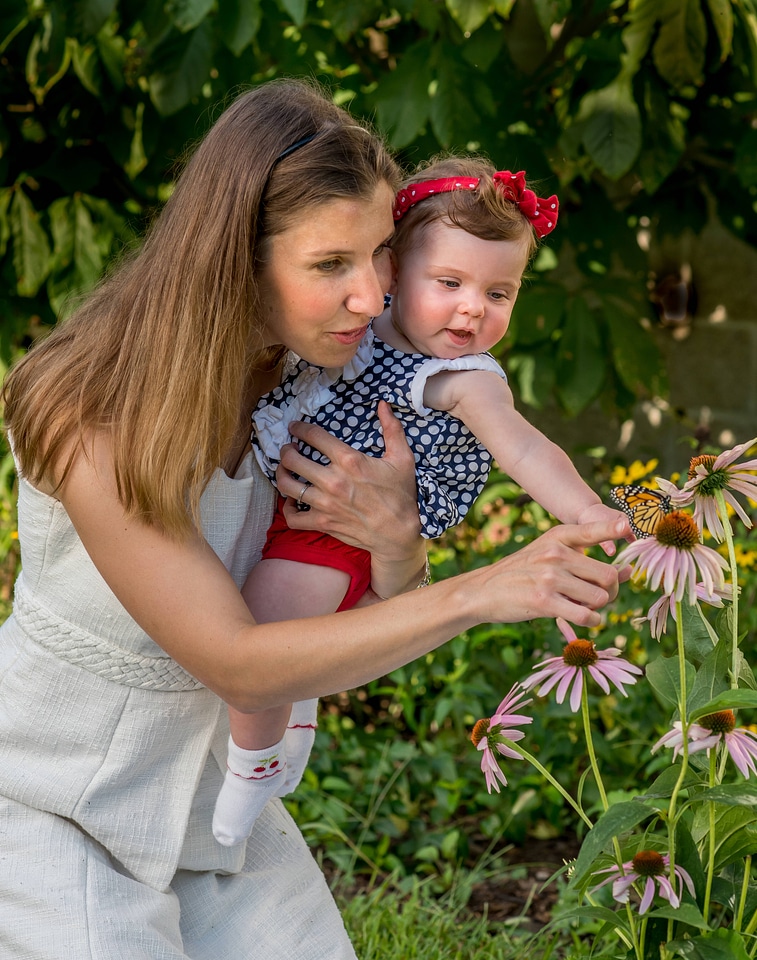 Mother and daughter looking at monarch-1