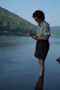 Refuge biologist counts freshwater mussels in river-3 photo