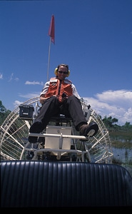 FWS employee on airboat photo