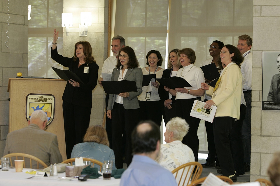 Laura Jones with group singing to Rick Lemon