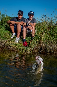 Two boys fishing for smallmouth bass