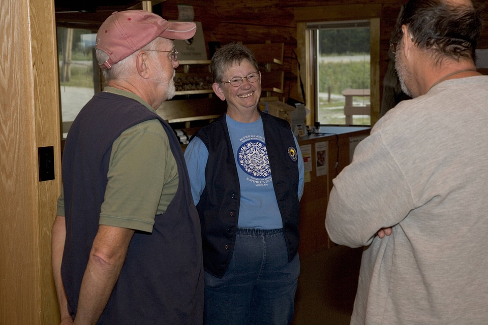 Visitors and volunteer working on crafts at Tetlin National Wildlife Refuge