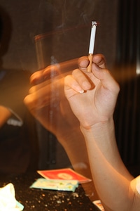 Smoke nightclubs man's hand