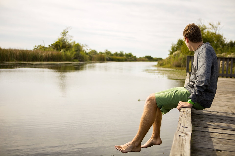 Refuge visitor relaxes on the dock-3 photo