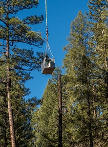 Helicopter lowers fish tank on cable-3