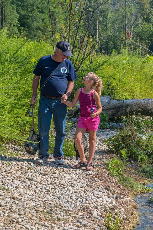 Older man with young girl fishing-1