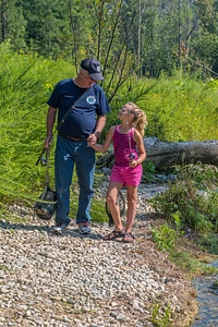 Older man with young girl fishing-1