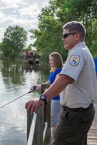 Ranger and young girl fishing-1