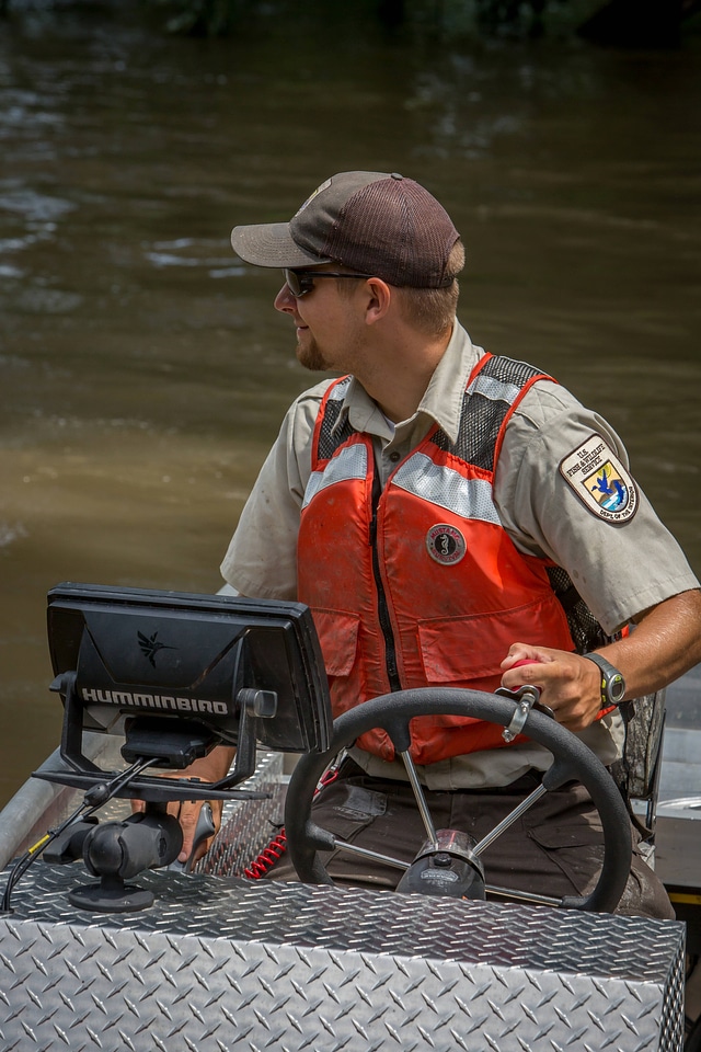 Biologist operates work boat searching for invasive carp-1