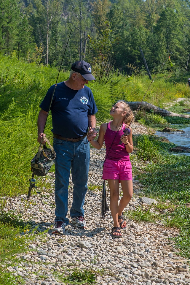 Older man with young girl fishing-1
