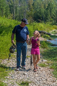 Older man with young girl fishing-1