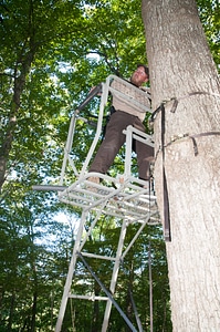 NCTC land management specialist inspecting deer stand for safety-1