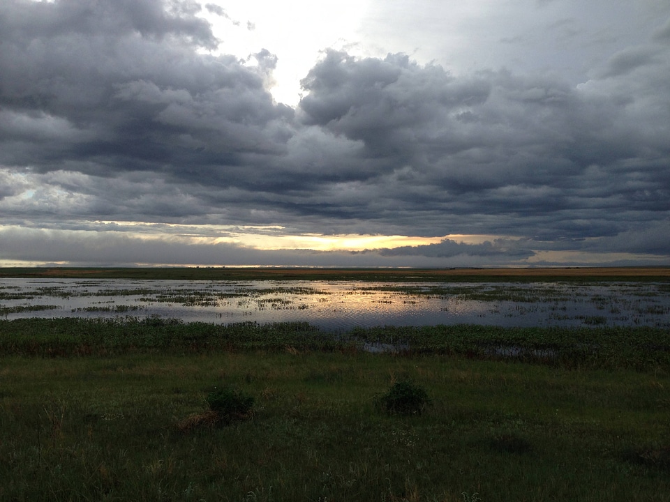 Depressional prairie pothole wetland at sunset