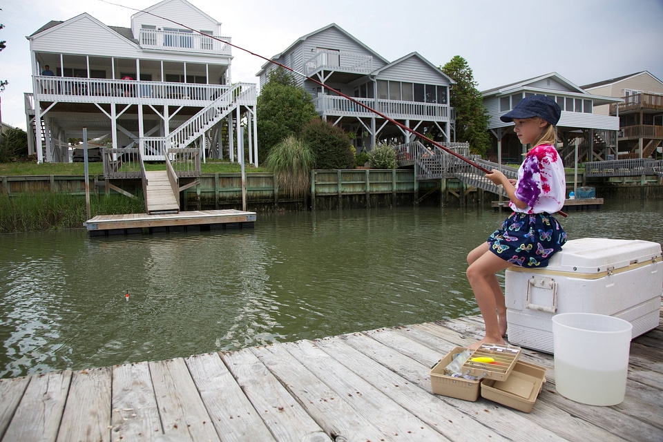 Girl fishing from dock