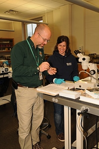 NCTC Fish Identification instructor helps a student