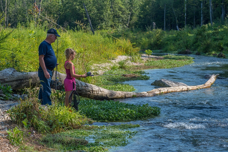 Older man with young girl fishing-1