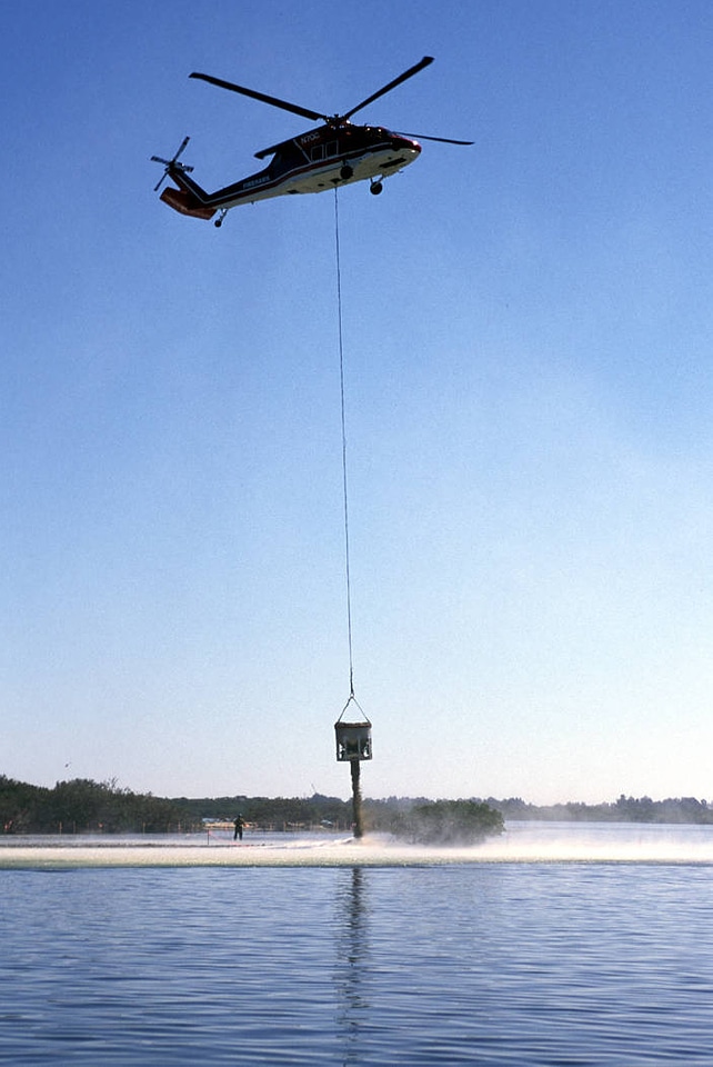 Helicopter dumps oyster shells at restoration site