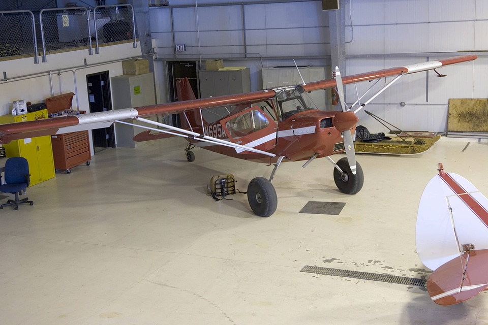 Plane inside storage building