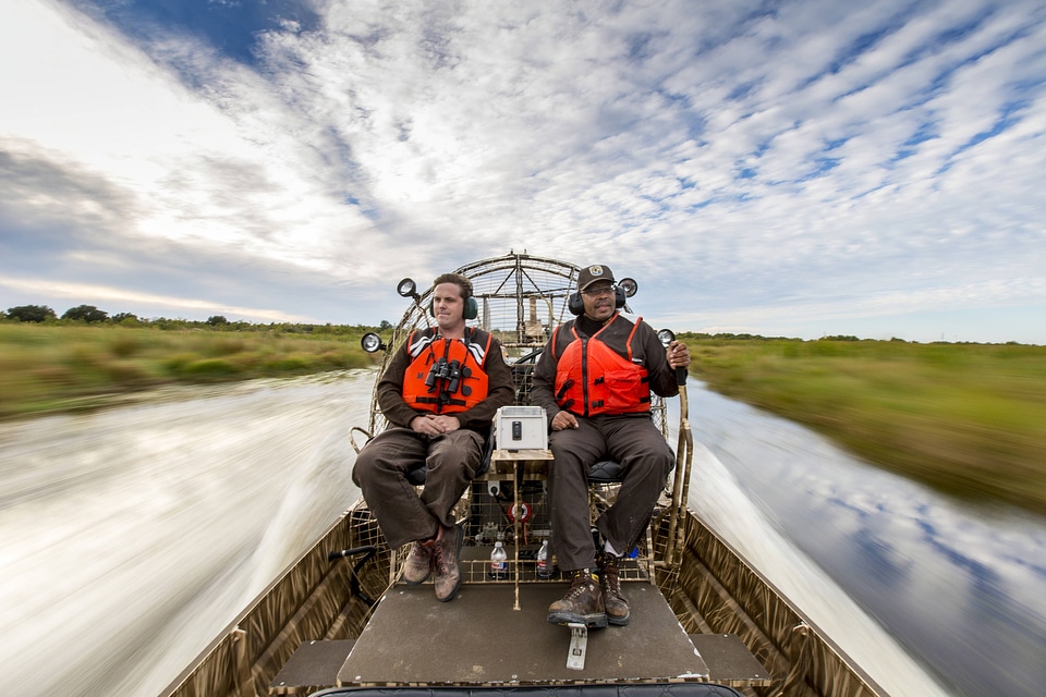 Employees operate an airboat at Bayou Sauvage NWR-5