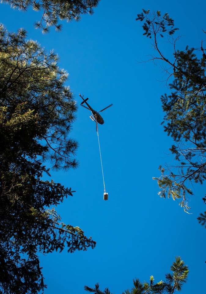 Helicopter lowers fish tank on cable-1